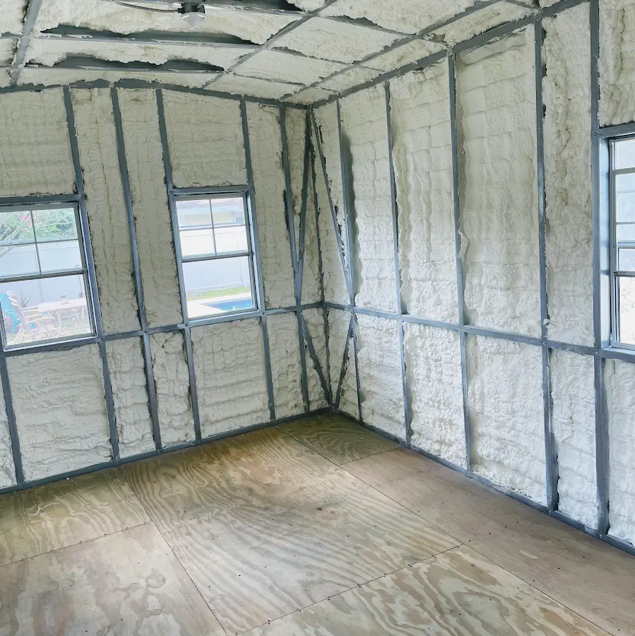 Closed-cell spray foam insulation applied to wall cavities in a residential project in Scottdale